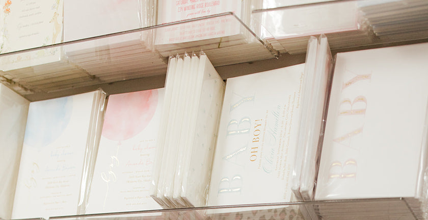 Shelves with various stationery items including notebooks and planners.